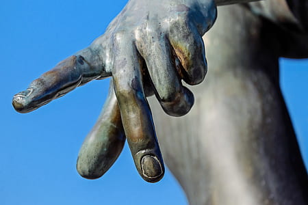 statue's hand during daytime