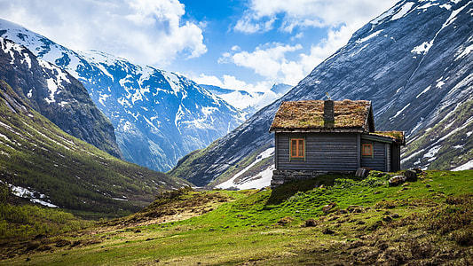 gray wooden house on mountain