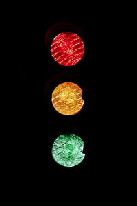 traffic light with red, yellow, and green lights on