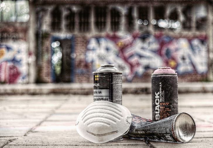 two black spray cans