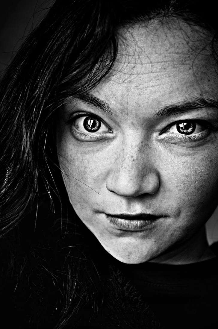 person's face grayscale portrait photo