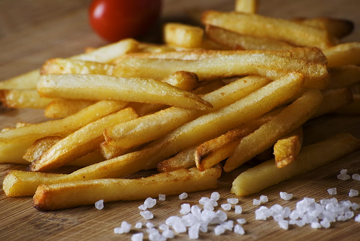 fried potato fries near salts