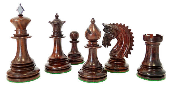 six brown chess pieces on white background