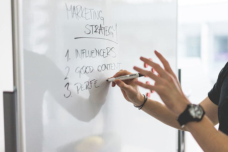 Marketing Expert Explaining New Marketing Strategy to Coworkers