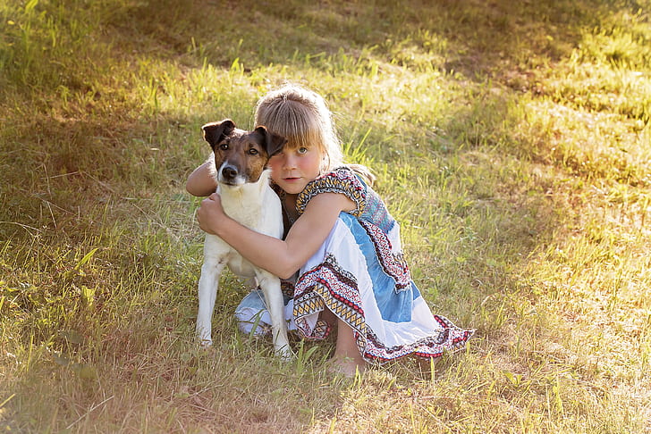 girl hugging the Jack Russell terrier