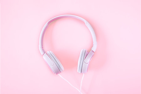 White headphones on pink