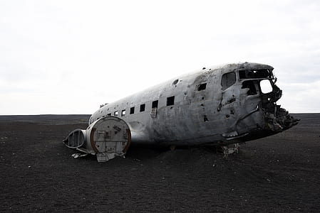 grayscale photo of crashed airplane