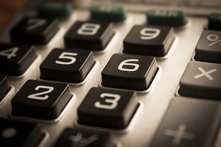 closeup photo of black and gray calculator