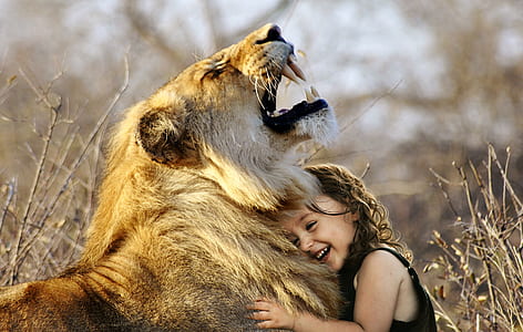 girl embracing lion