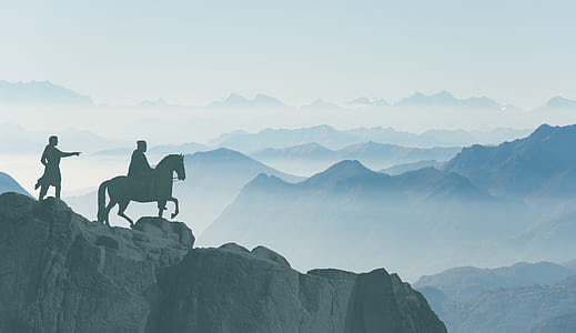 silhouette of horseman on mountain