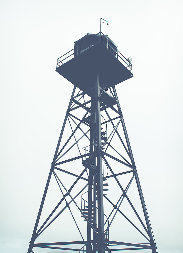grey scale photo of light tower