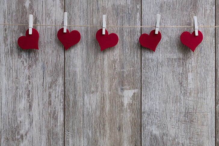 photo of five heart sticker clipped on string