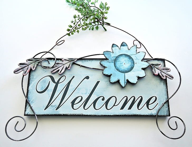 gray and black wooden welcome wall deco