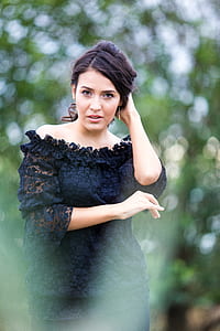 woman in black lace off-shoulder dress