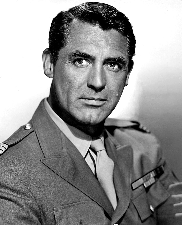 grayscale photograph of man in uniform