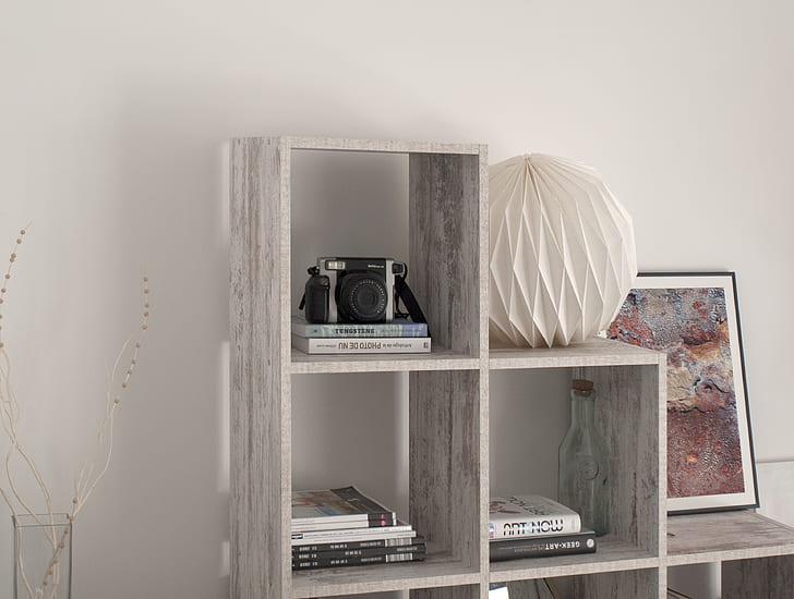 closeup photo of gray wooden cubby shelf