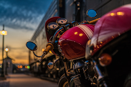 selective focus photography of red motorcycle