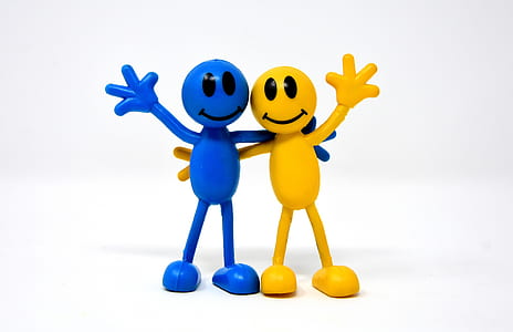 yellow and blue smiley stick man figures