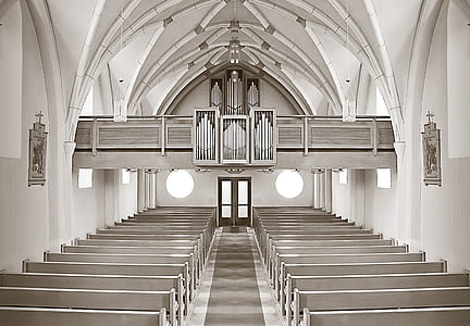 grayscale photo of church hallway