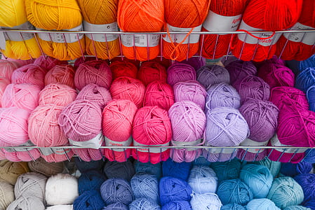 photo of assorted-color yarn thread spool lot