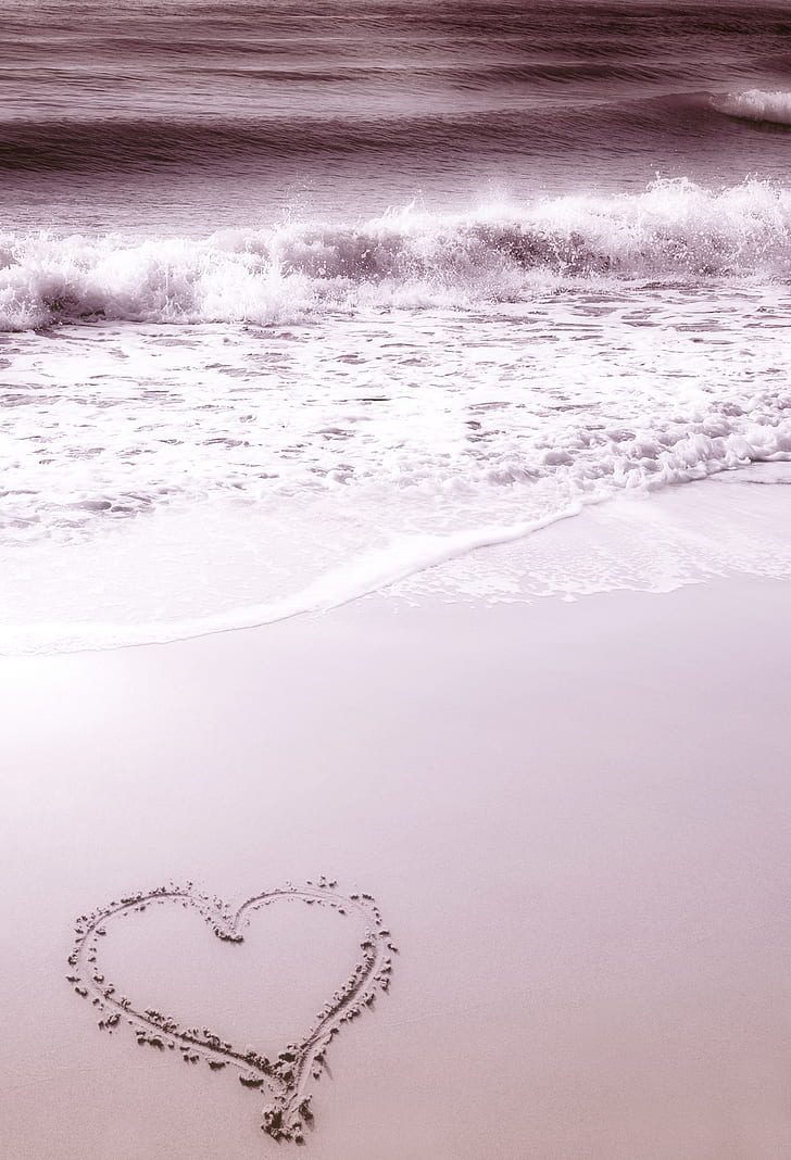 heart sand decor near ocean