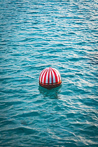 white and red striped bouy