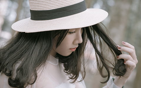 Woman Wearing White and Black Hat