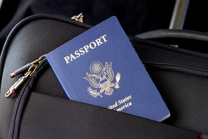 blue Passport and black bag