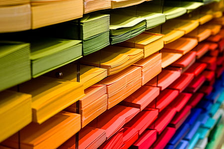 assorted-color of printing papers inside rack