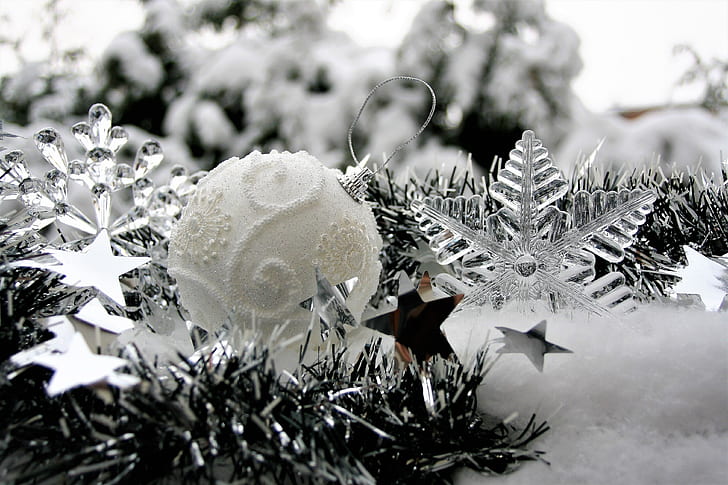 greyscale photo of Christmas bauble and clear snowflake decors