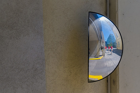 Close-up street shot of a half-mirror, image captured in Linz, Austria