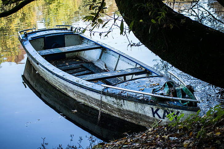 docked white canoe