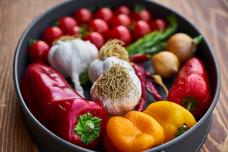 assorted-color vegetables in round black pan
