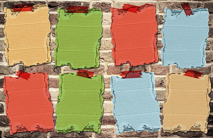 illustration of assorted-color cardboards on wall