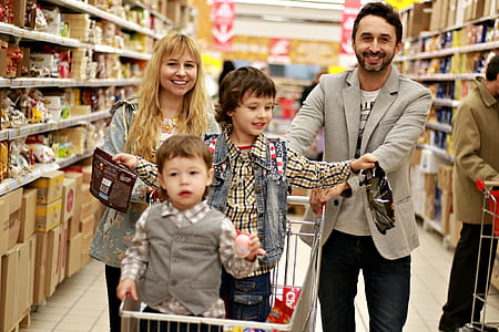 man, woman, and children's doing groceries