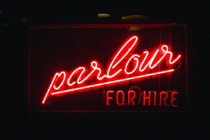 lighted red parlour for hire neon signage