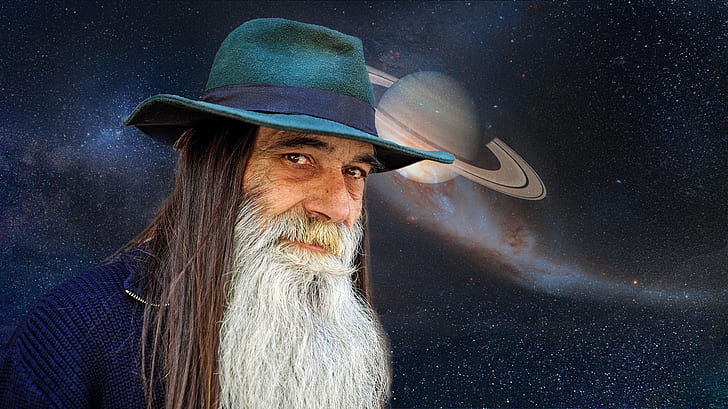 man in blue hat with planet background