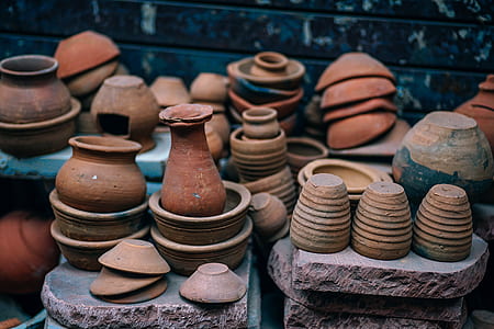 brown clay pots on stone