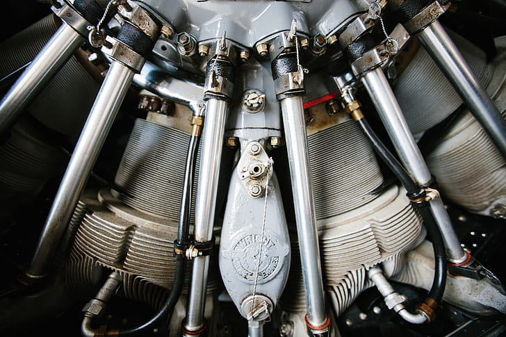 close up photo of grey and black metal engine