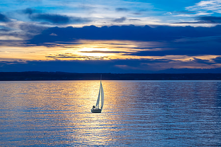 landscape photography of sailboat on body of water