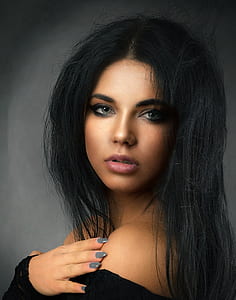 portrait photography of woman in black top