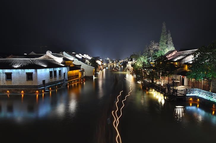Houses Near a Body of Water during Nigh Time