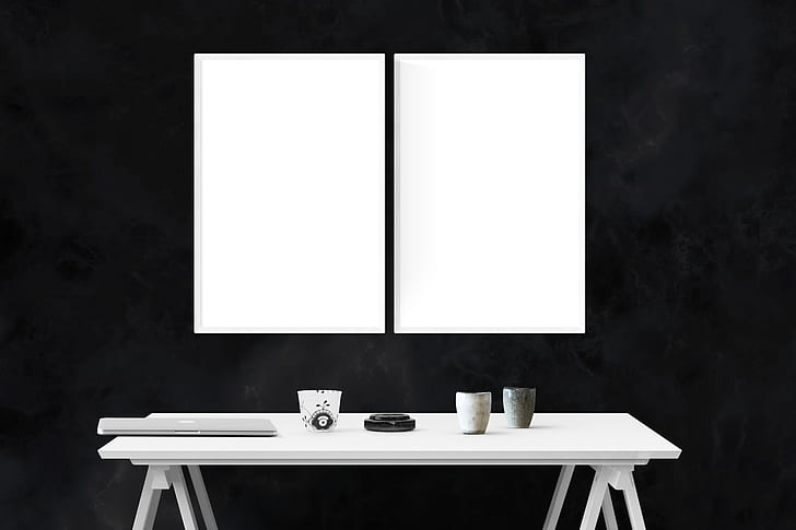 two white boards and white wooden table