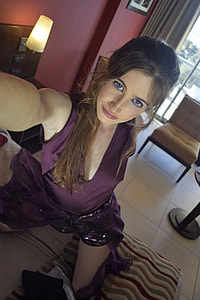 photo of woman wearing purple top