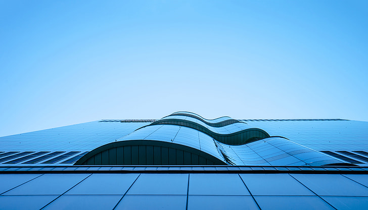 low angle architectural photography of glass building