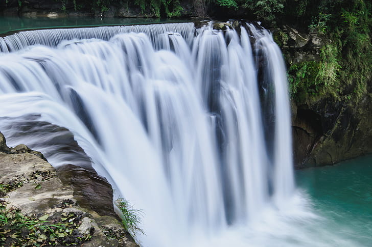 timelapse photography of flowing multi-tier waterfalls