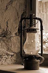 black lantern beside window