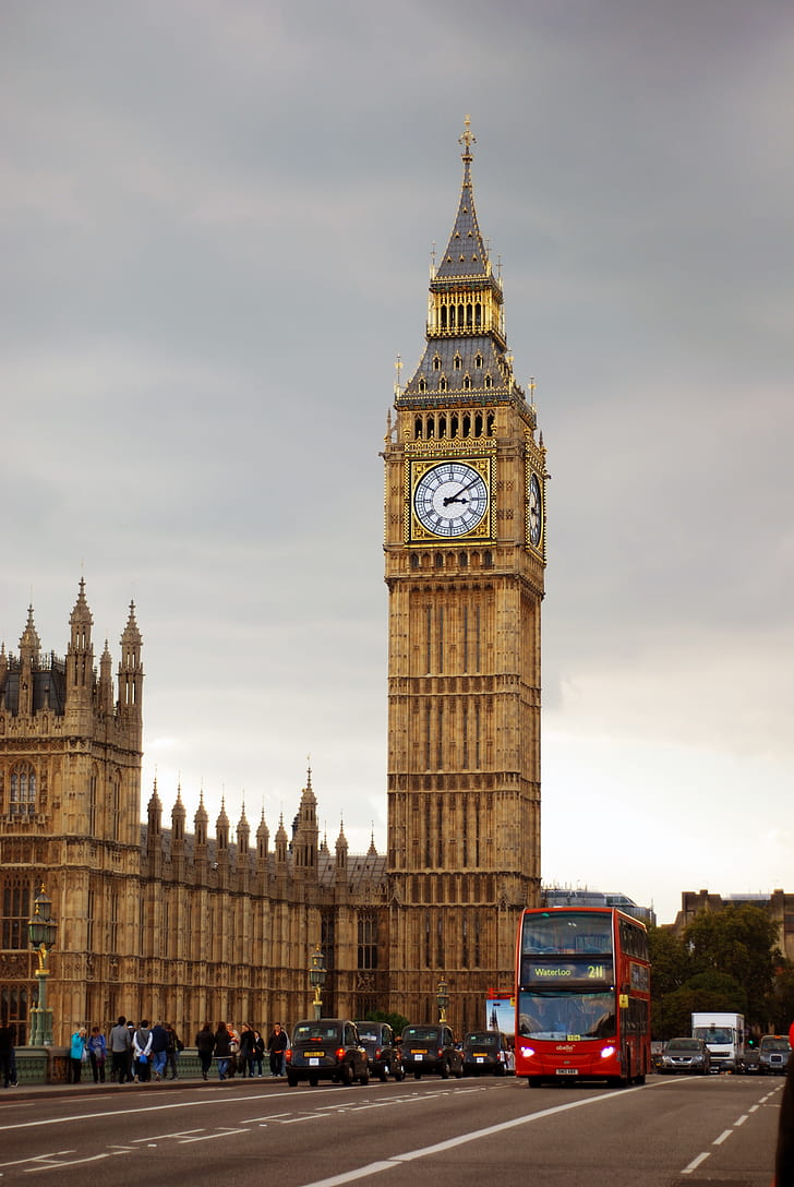 Big Ben Tower Near City Road With Bus and Cars Traveling Under Gray White Clouds