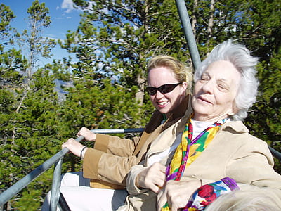 woman wearing brown jacket on amusement ride