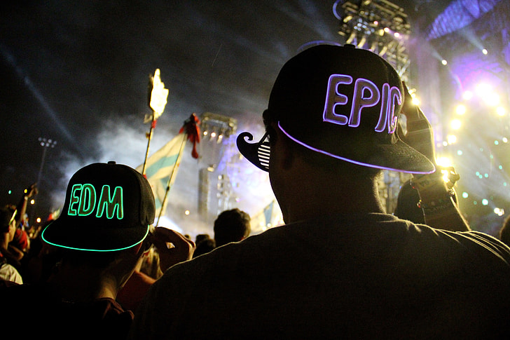 People in the crowd at an electronic music festival